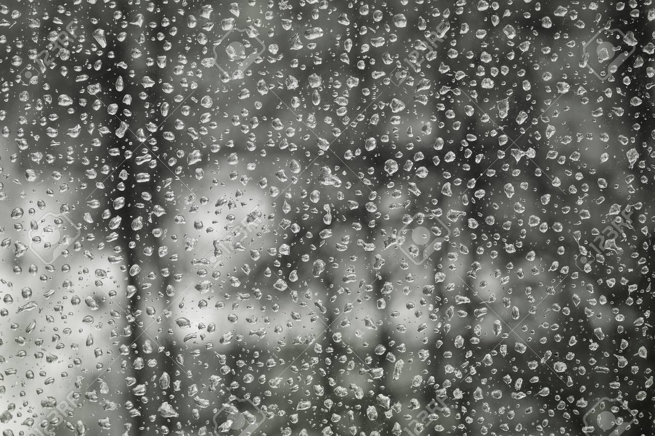 55435974-water-drops-of-rain-on-the-window-glass-in-gloomy-weather-street-bokeh.jpg