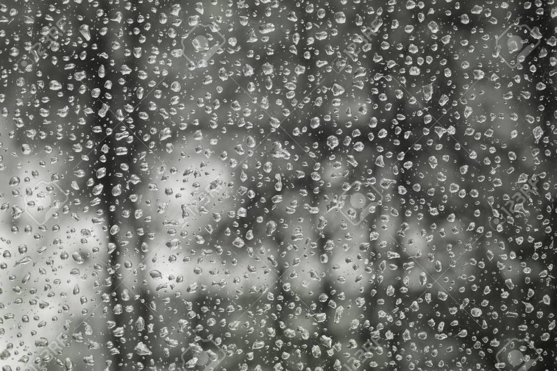 55435974-water-drops-of-rain-on-the-window-glass-in-gloomy-weather-street-bokeh.jpg
